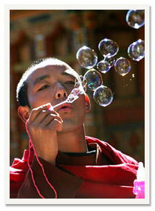YWAM Bhutan - Monk Blows Bubbles